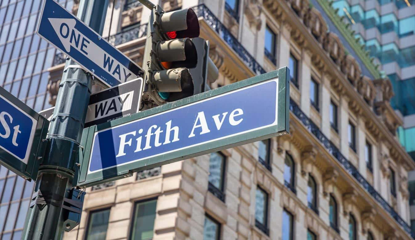 Intersection with "Fifth Ave" sign and classic Manhattan vibe.