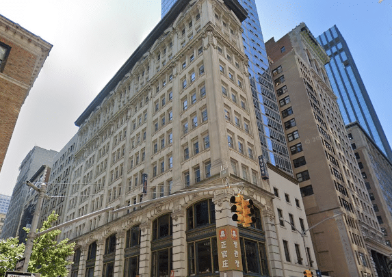 Office building at 315 Fifth Avenue with commercial space, featuring classic architecture, large windows, and ornate detailing in Midtown Manhattan.