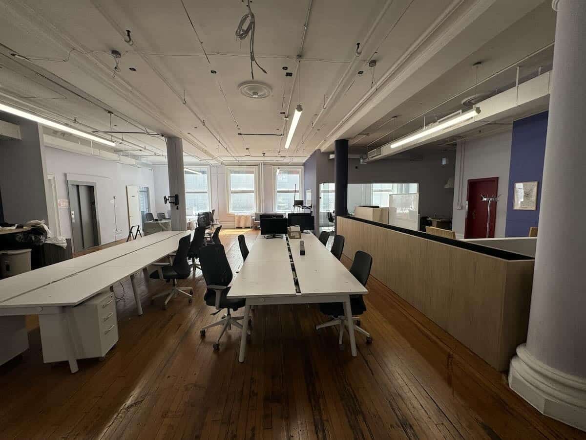 Office on 4th floor at 29 East 19th St with desks and chairs