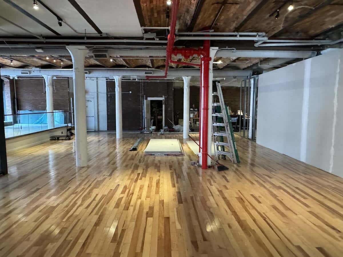 Industrial-style interior with wooden floors and exposed brick walls.