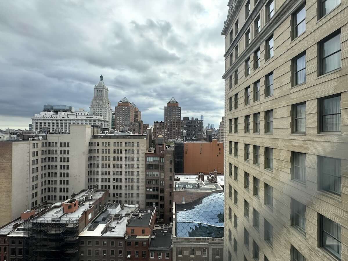 A cityscape view with buildings along Park Avenue and an overcast sky.