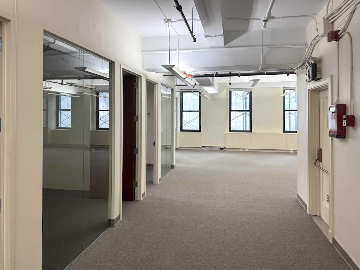 Sleek hallway with glass doors and large windows at 315 Madison Ave.