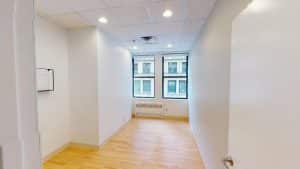 Office at 928 Broadway, Suite #405 with windows and white walls.