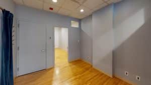 Suite #405, light blue walls, wooden floor, 928 Broadway.