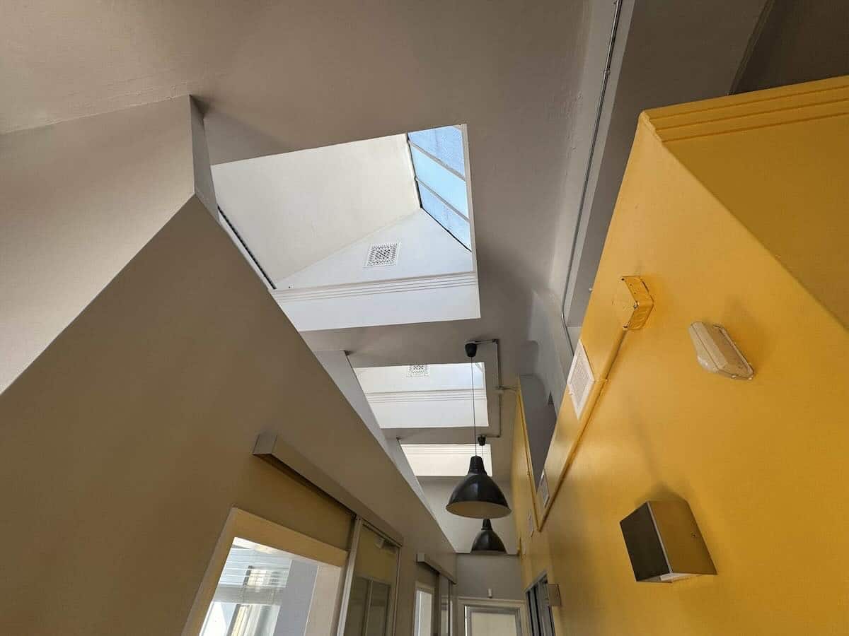 Interior of 1133 Broadway with slanted ceiling and skylights.