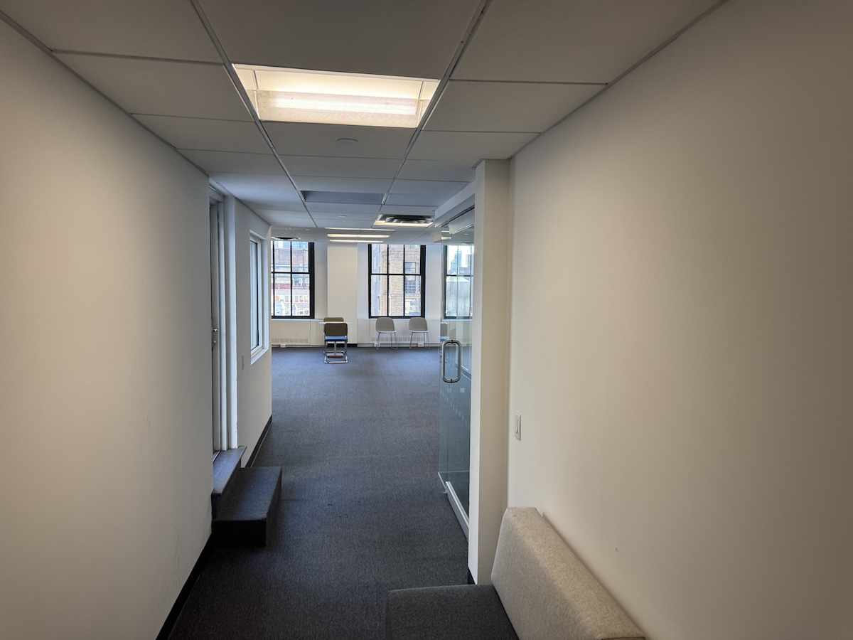 Hallway at 18 East 40th Street leading to office space.